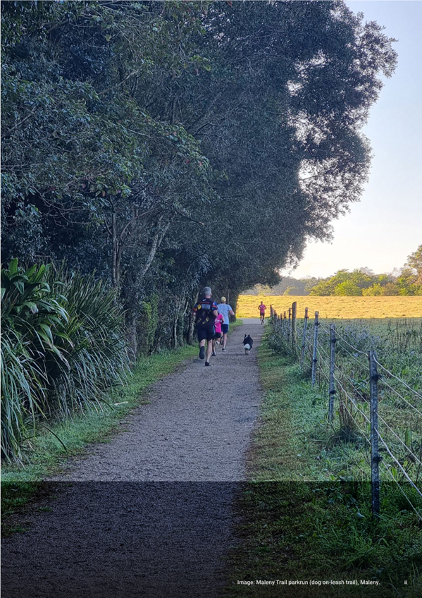 People walking on a path with trees and grass

AI-generated content may be incorrect.